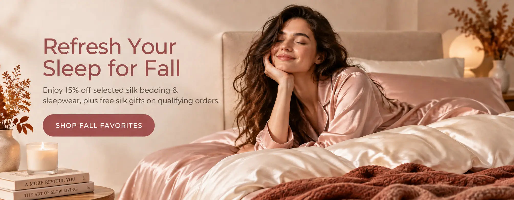 Woman relaxing on blush silk bedding in a warm fall bedroom with the message Refresh Your Sleep for Fall.